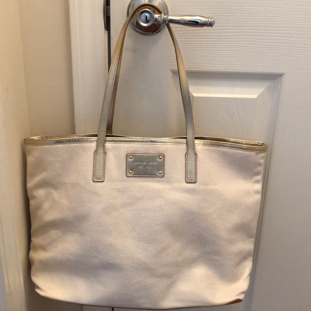 Michael Kors white and  gold tote bag.